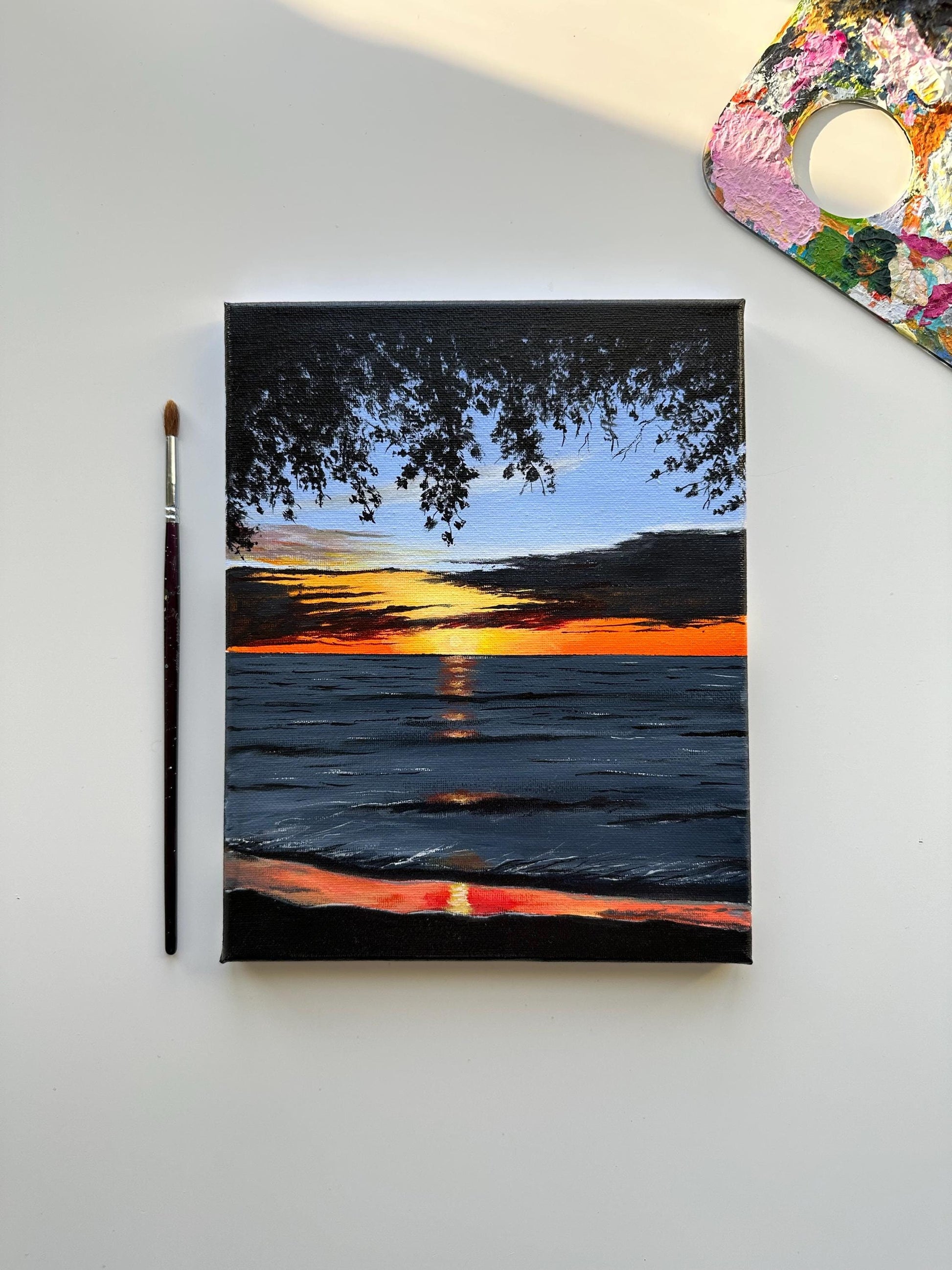 Golden Sunset Reflections on Ocean. Acrylic painting with vibrant colors on stretched canvas.