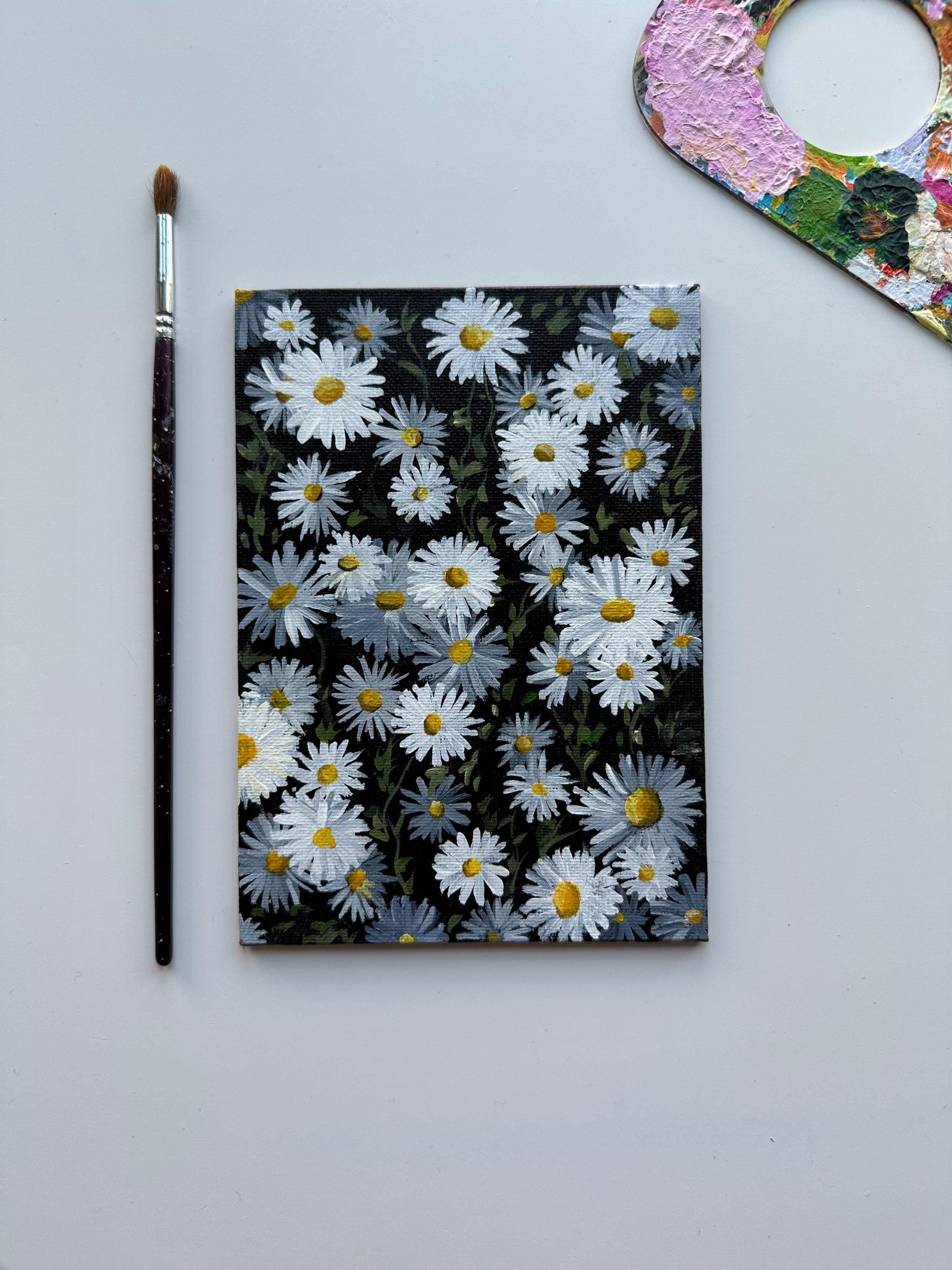 Daises acrylic painting on 5”x7” canvas board by ab mini art. Daises field with titanium white and black color. Traditional painting for home decor and wall art. Original artworks for gifts.